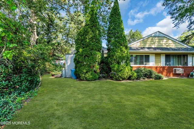 a view of front of house with a yard