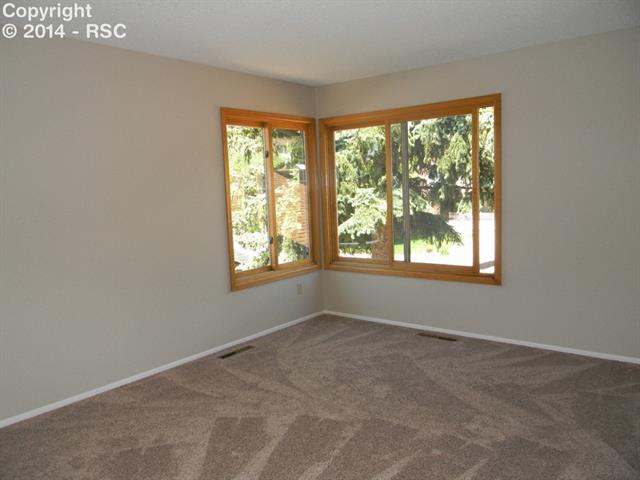 692 Gilcrest Road Colorado Springs, CO 80906 - Photo 12 of 25 Large master suite with lots of natural light