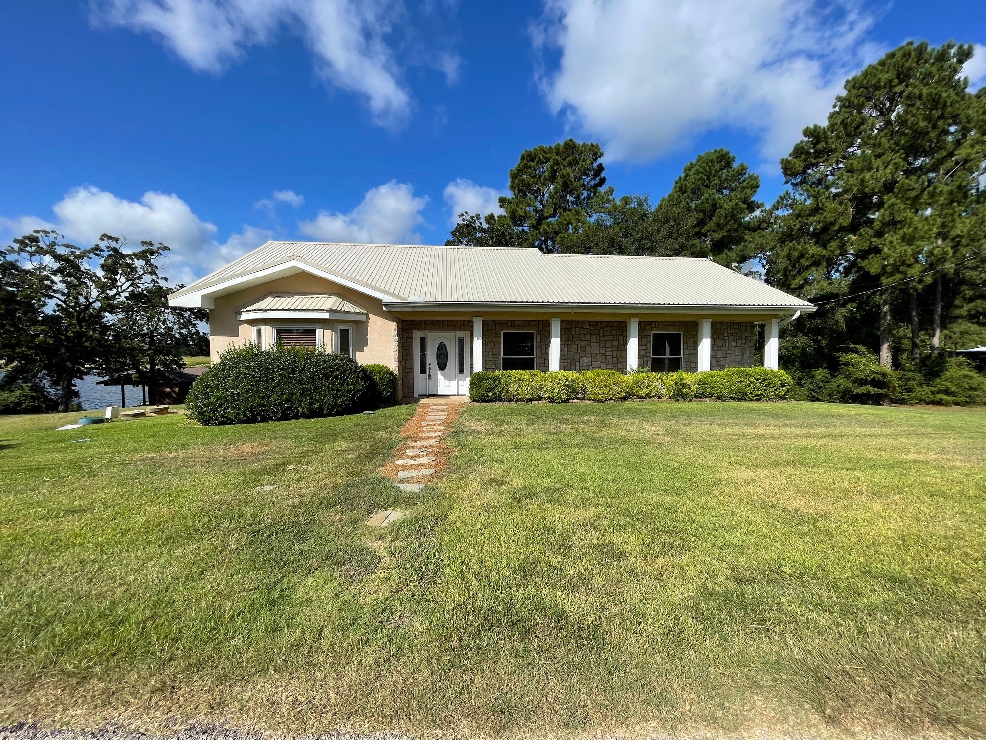a front view of a house with a yard