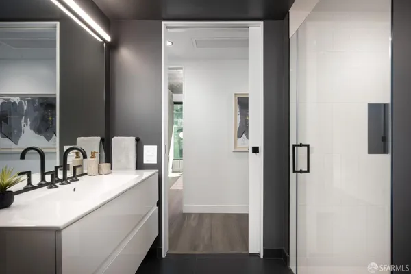 a bathroom with a sink and a mirror