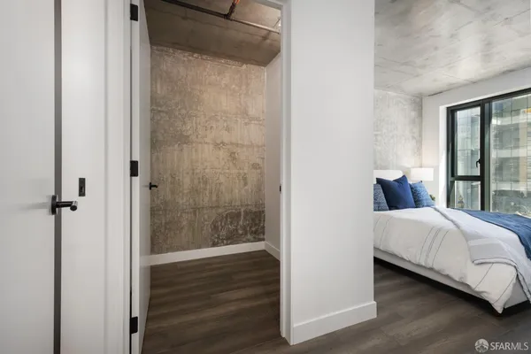 a bedroom with a bed and a mirror