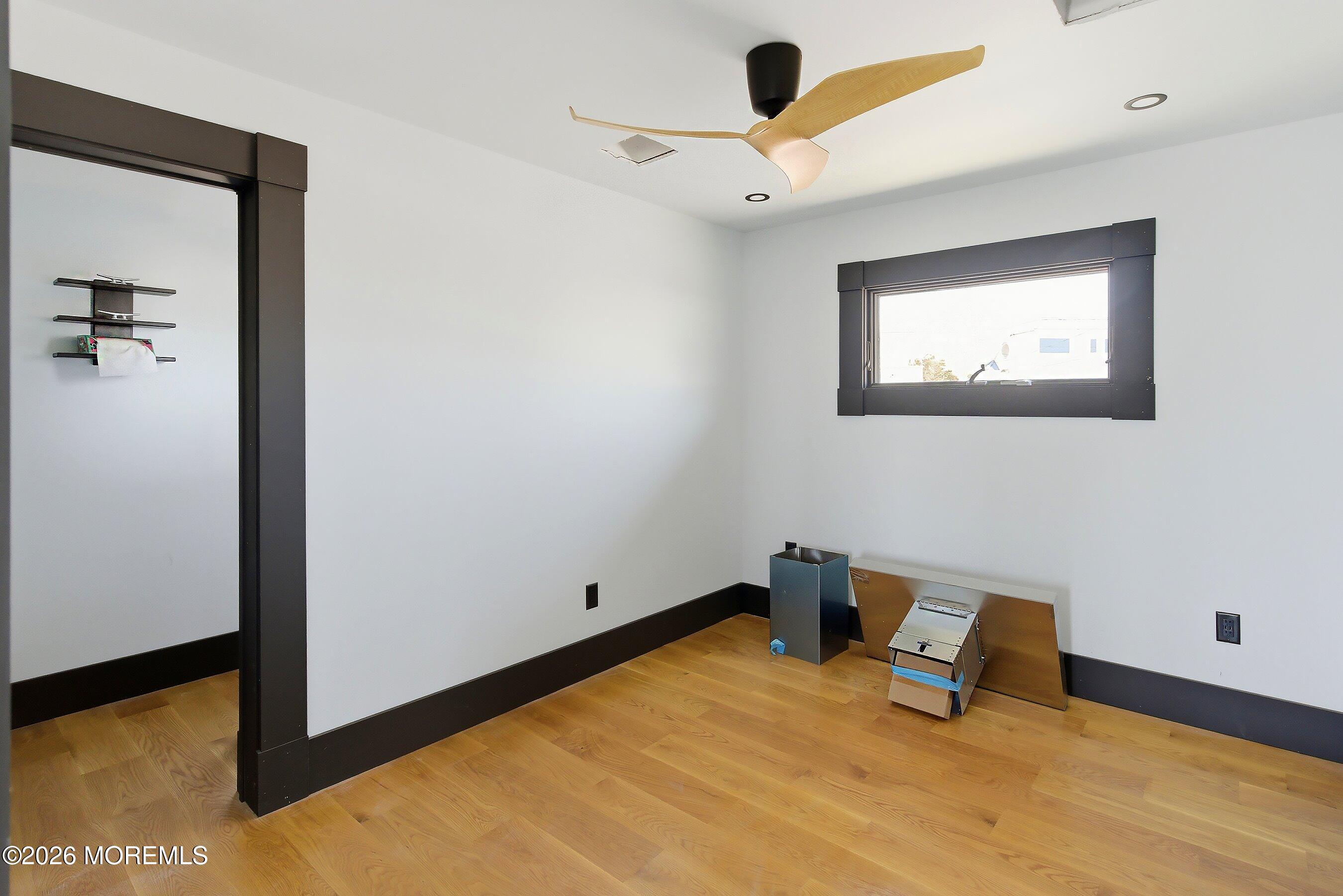 48 Parker Road Tuckerton, NJ 08087 - Photo 9 of 35 a room with a bed and a ceiling fan