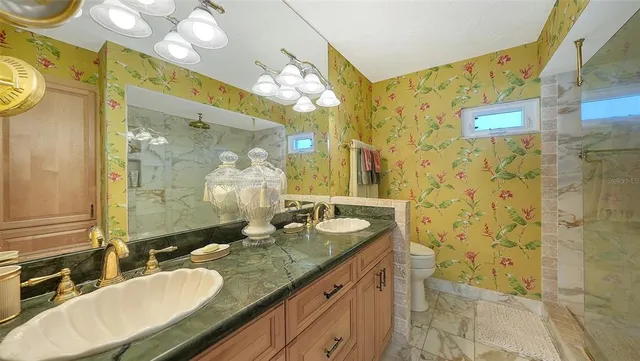 a bedroom with a balcony a bed and a window