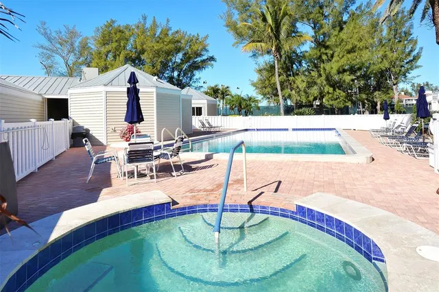 a view of a house with sitting area and garden