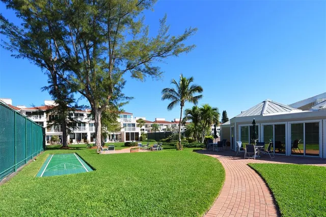 a view of a dining room with furniture and a window