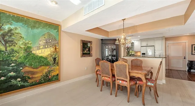a kitchen with stainless steel appliances granite countertop a sink refrigerator and cabinets