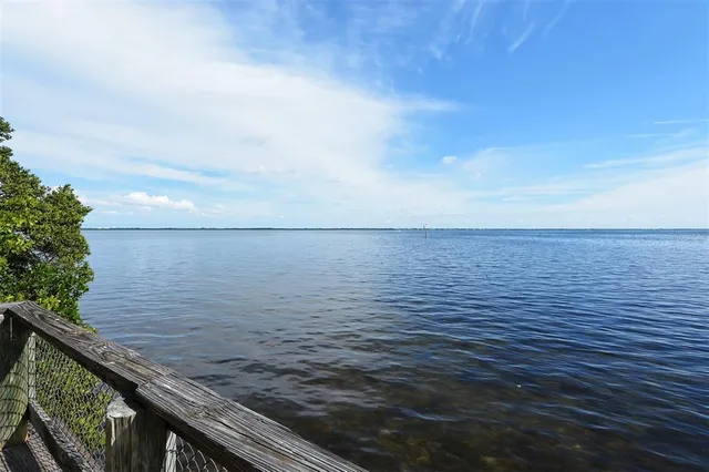 a view of a golf course with a lake view