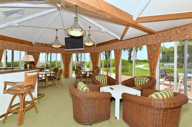 a view of a chair and table on the wooden floor