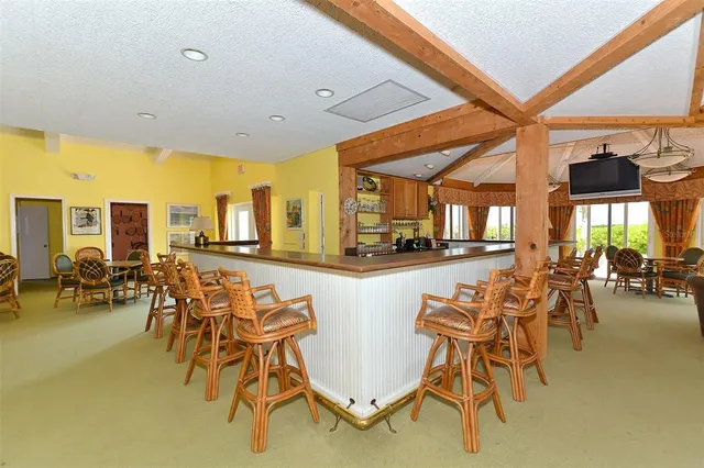 a view of a water pond with an outdoor seating