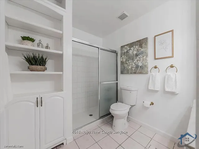 a bathroom with a toilet and a sink