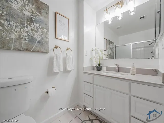 a bathroom with a sink and mirror