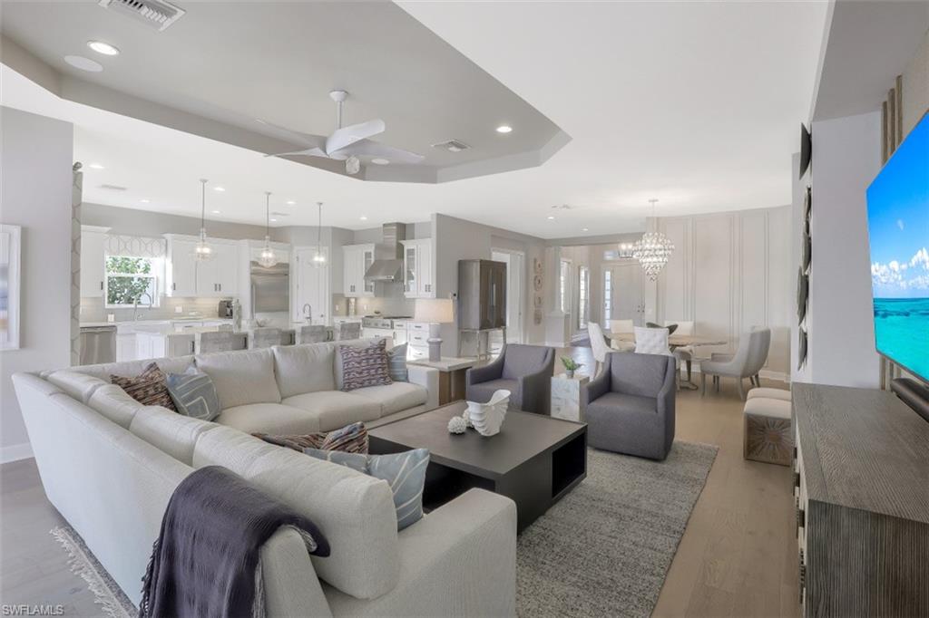 3258 Belon Lane Naples, FL 34114 - Photo 10 of 35 a living room with furniture kitchen view and a large window