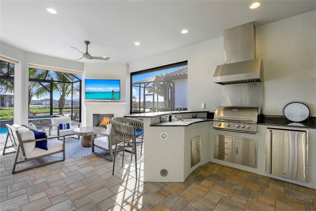 3258 Belon Lane Naples, FL 34114 - Photo 13 of 35 a kitchen with sink cabinets and window