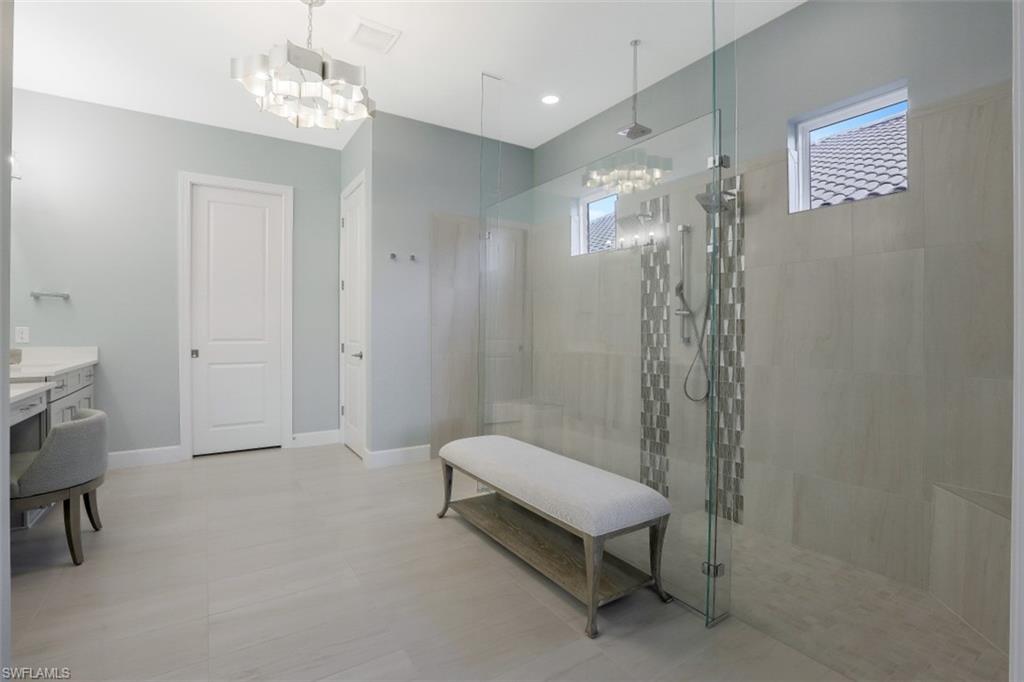 3258 Belon Lane Naples, FL 34114 - Photo 22 of 35 a bathroom with a toilet a sink and shower