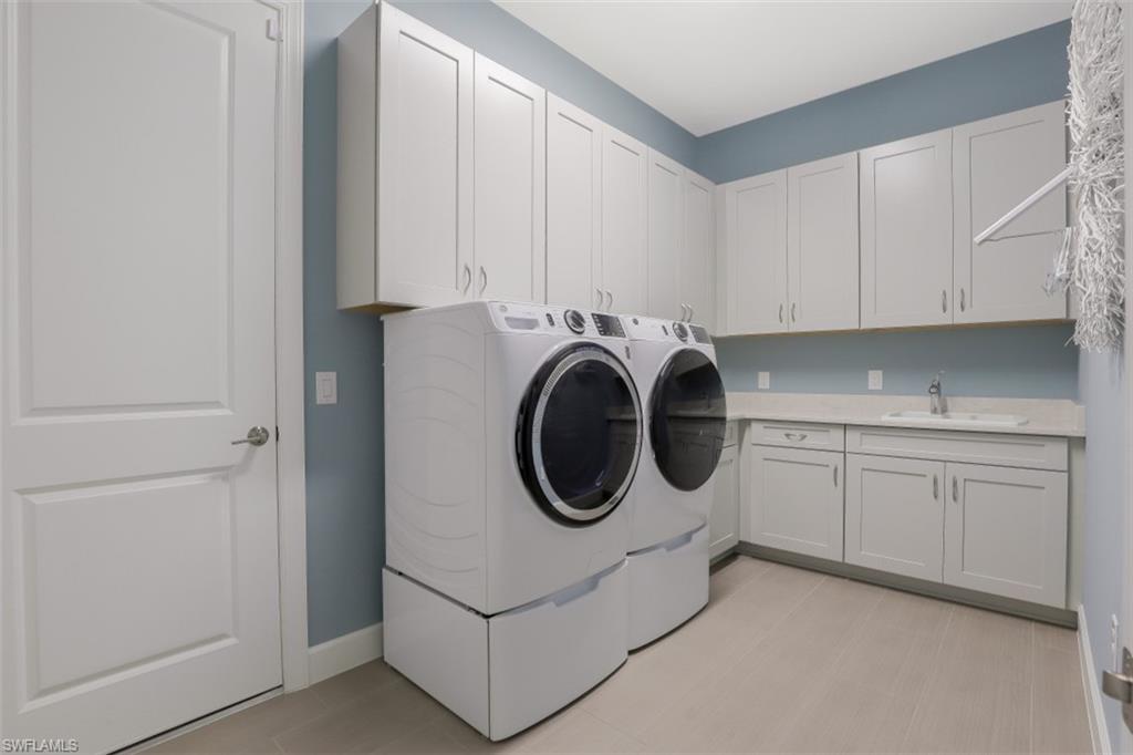 3258 Belon Lane Naples, FL 34114 - Photo 28 of 35 a utility room with sink dryer and washer