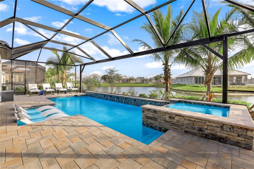 3258 Belon Lane Naples, FL 34114 - Photo 3 of 35 a view of a swimming pool with a lounge chairs