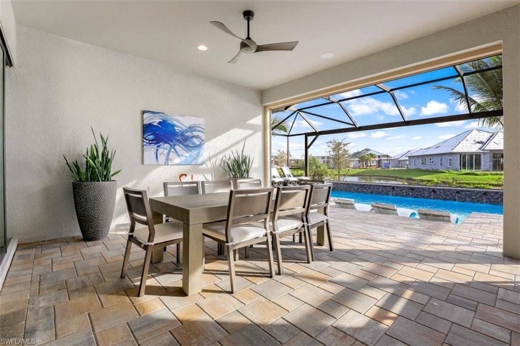 3258 Belon Lane Naples, FL 34114 - Photo 35 of 35 a dining room with furniture and a floor to ceiling window