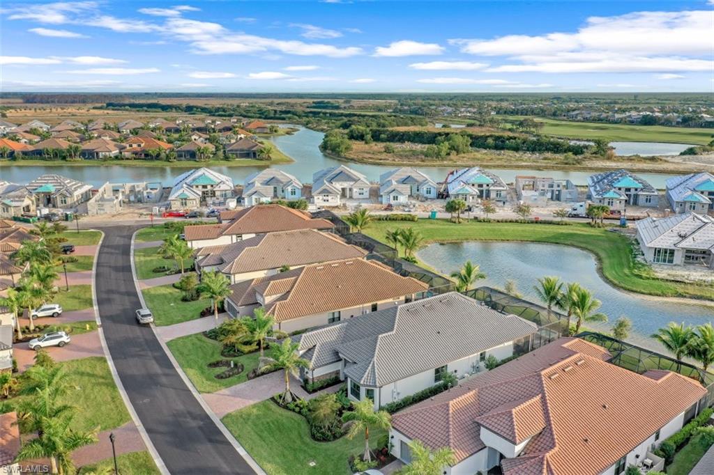 3258 Belon Lane Naples, FL 34114 - Photo 5 of 35 an aerial view of residential houses with outdoor space and ocean view