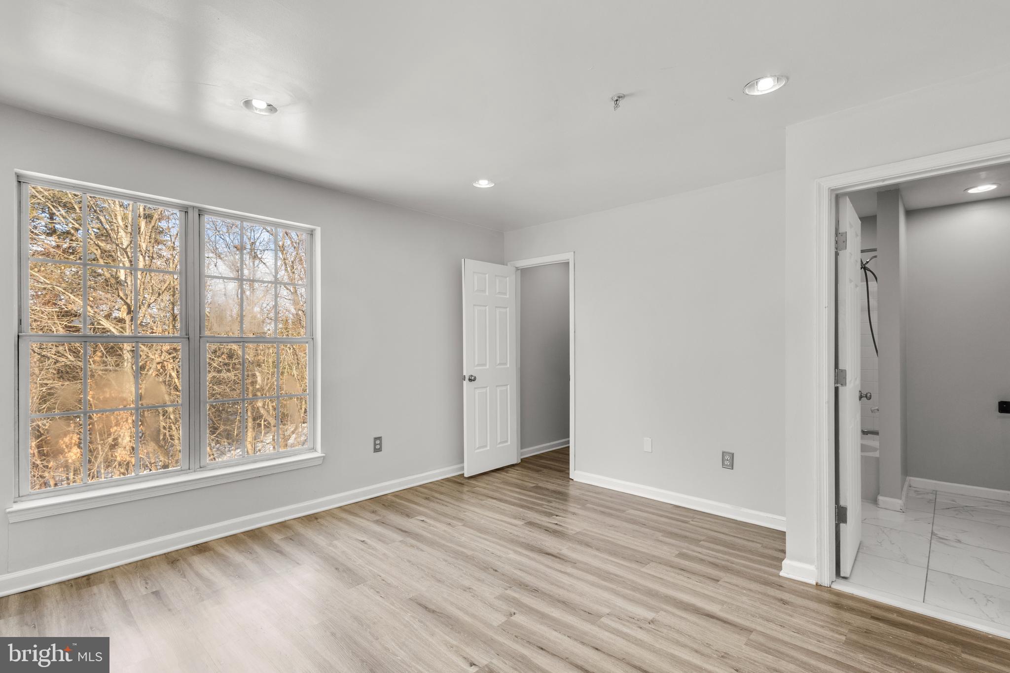 7510 Maury Road Baltimore, MD 21244 - Photo 15 of 39 a view of an empty room with wooden floor and a window