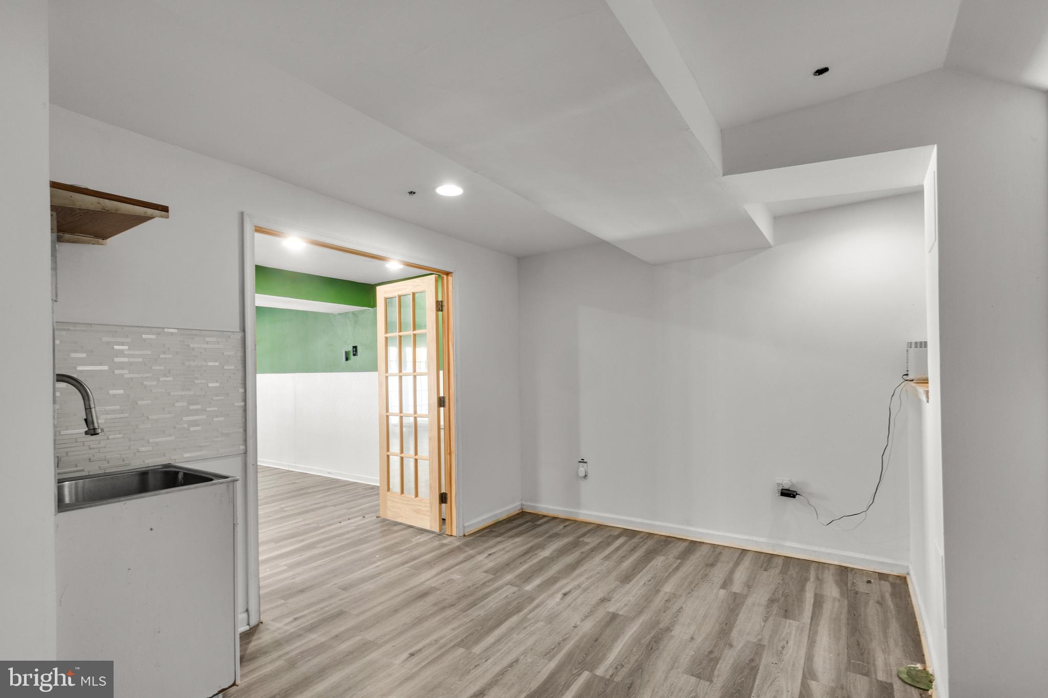 7510 Maury Road Baltimore, MD 21244 - Photo 30 of 39 a view of a room with wooden floor and a bathroom