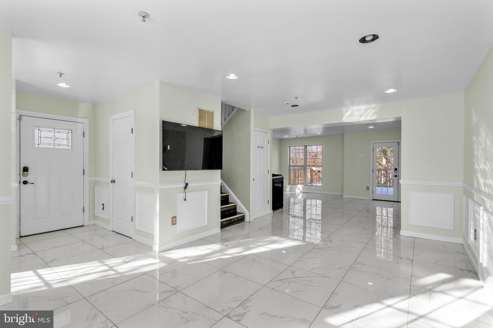 7510 Maury Road Baltimore, MD 21244 - Photo 6 of 39 a view of a livingroom with kitchen space and furniture