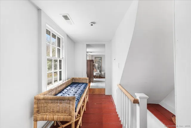 a large white bed in a white room