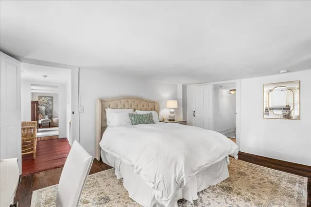 a bathroom with a sink a mirror and a shower