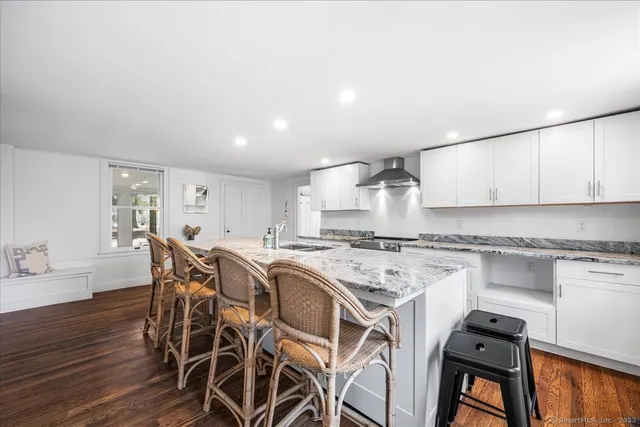 a kitchen with a stove a sink and a refrigerator