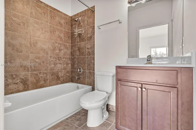 a bathroom with a sink a toilet and a bathtub