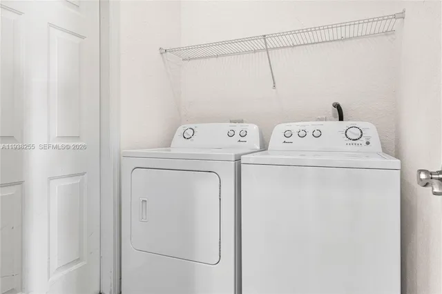 a utility room with dryer and washer