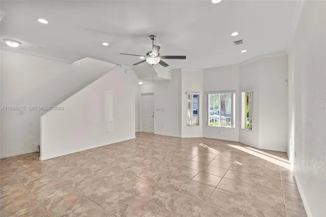 a view of an empty room with a window