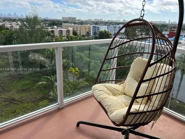 a view of a balcony with furniture