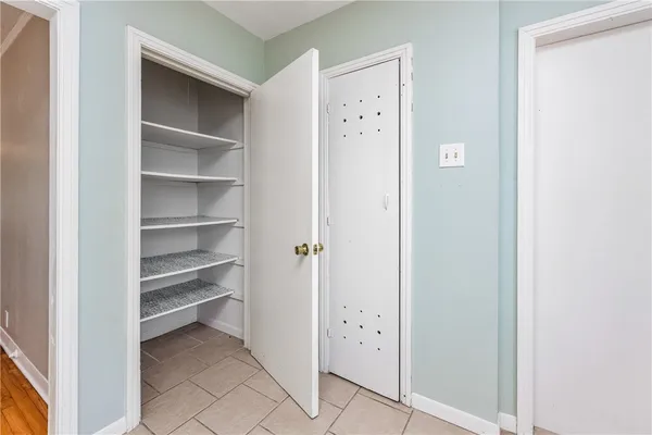 a view of a hallway with closet