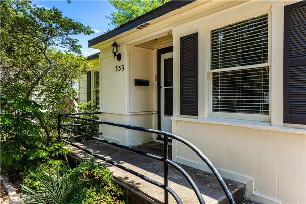 a view of a house with a large window