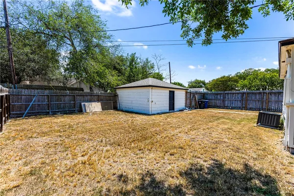 a backyard of a house with lots of green space