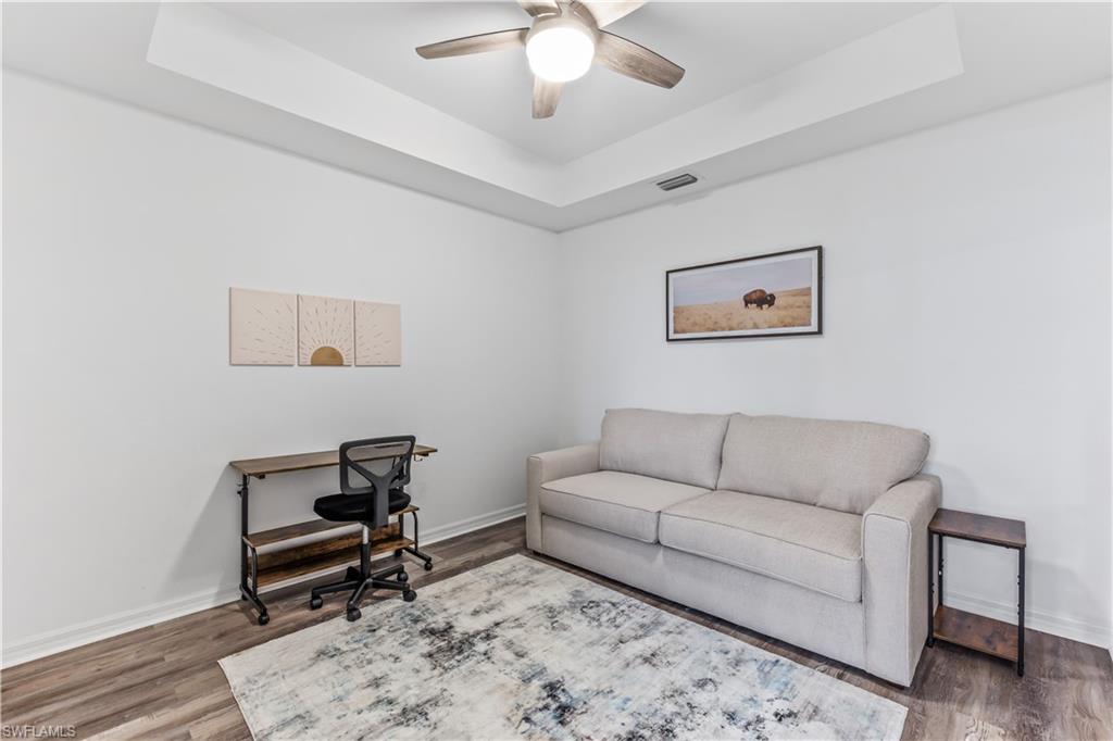 Undisclosed Address Punta Gorda, FL 33982 - Photo 14 of 14 a living room with furniture and a dresser