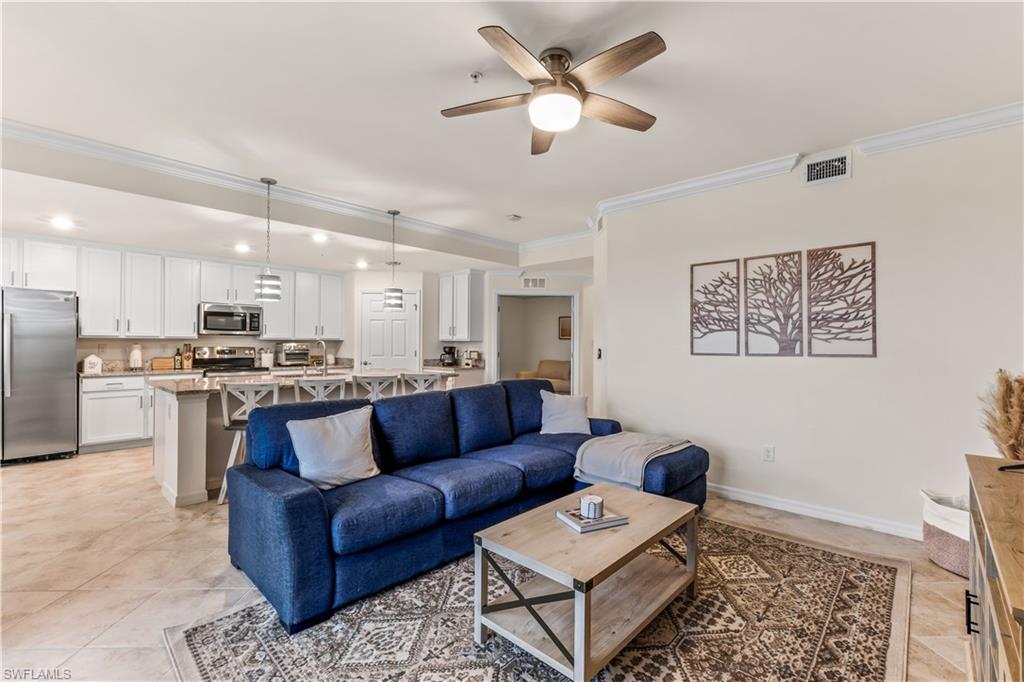 Undisclosed Address Punta Gorda, FL 33982 - Photo 4 of 14 a view of living room kitchen with stainless steel appliances kitchen island granite countertop furniture and a rug