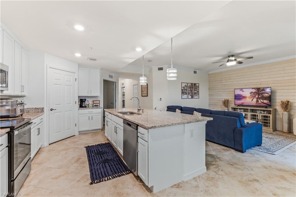 Undisclosed Address Punta Gorda, FL 33982 - Photo 6 of 14 a large kitchen with stainless steel appliances granite countertop a stove oven and a refrigerator with white cabinets