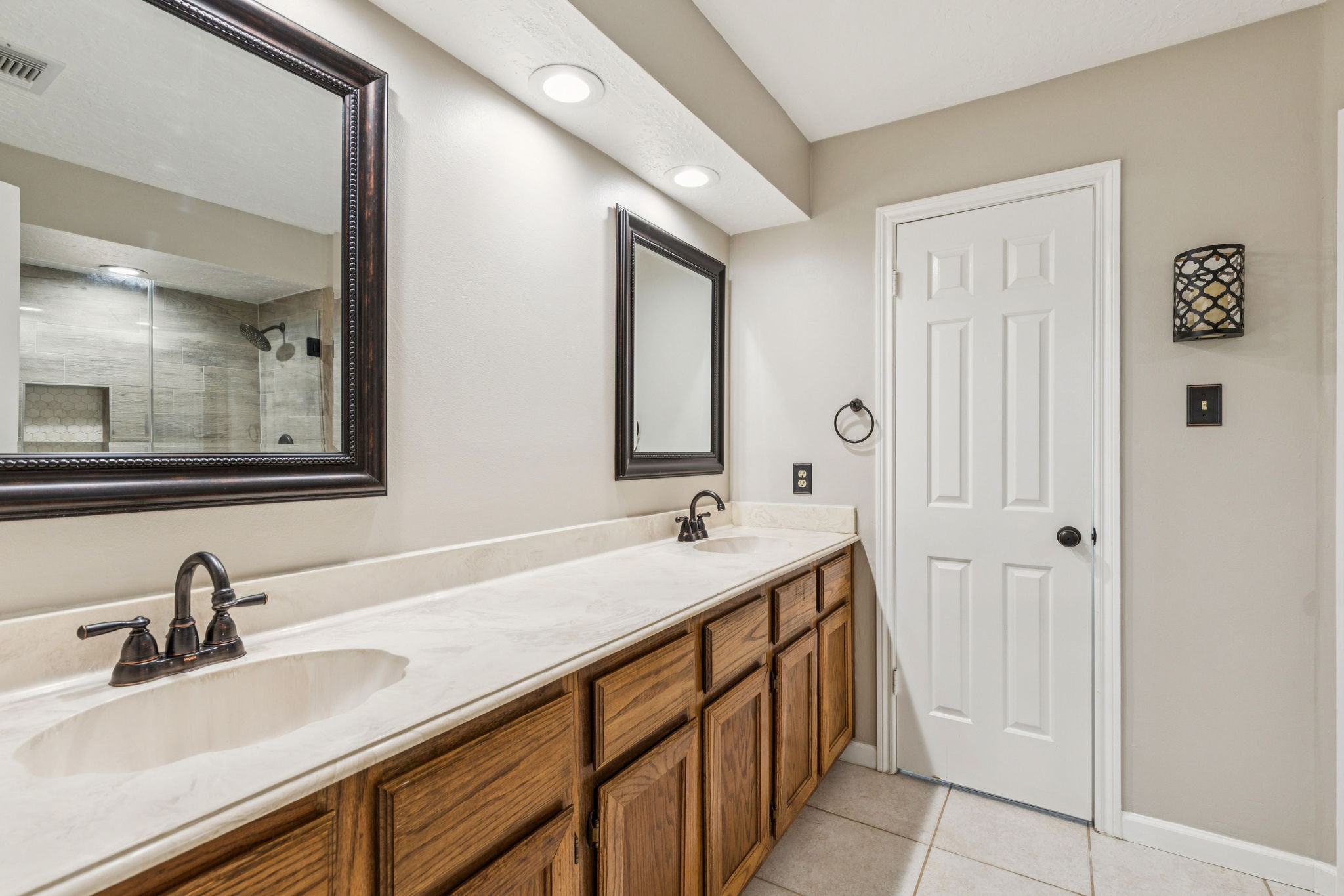 3630 Chapel Square Drive Spring, TX 77388 - Photo 8 of 24 The primary bath offers dual vanities with plenty of storage, roomy enough to move around comfortably.