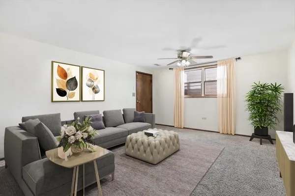 a living room with furniture and a window