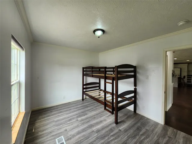 a view of a house with backyard and porch