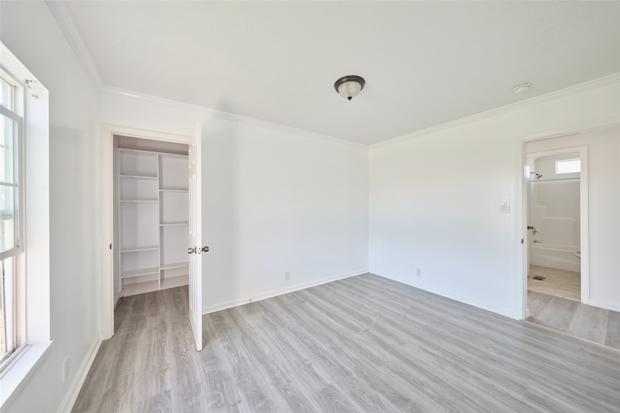 928 Coen Road Rosharon, TX 77583 - Photo 14 of 18 wooden floor in an empty room