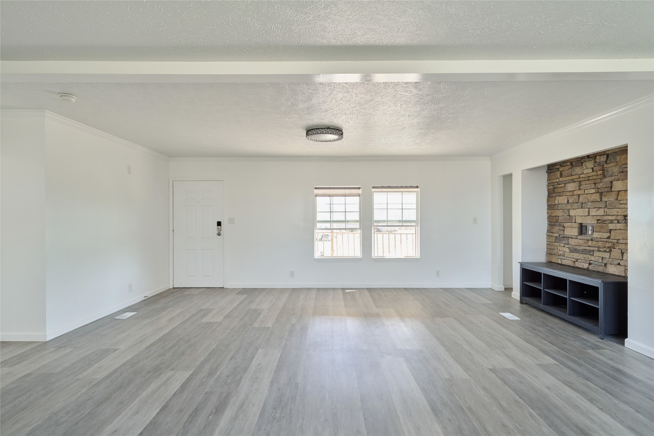 928 Coen Road Rosharon, TX 77583 - Photo 6 of 18 wooden floor in an empty room with a window