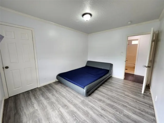 a bathroom with a granite countertop toilet a sink and a mirror