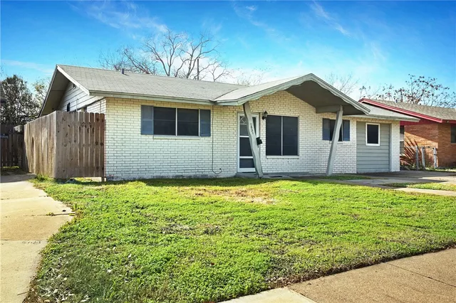 a house view with a garden space