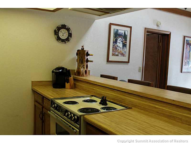 520 Bills Ranch Road, Unit B 333 Frisco, CO 80443 - Photo 3 of 12 a kitchen with a stove and cabinets