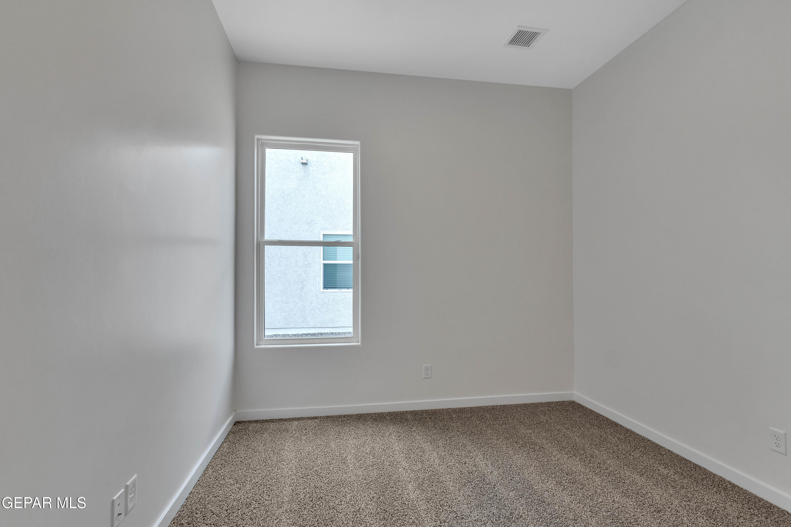 7264 Cimarron Rim Drive El Paso, TX 79911 - Photo 12 of 21 a view of an empty room with a window