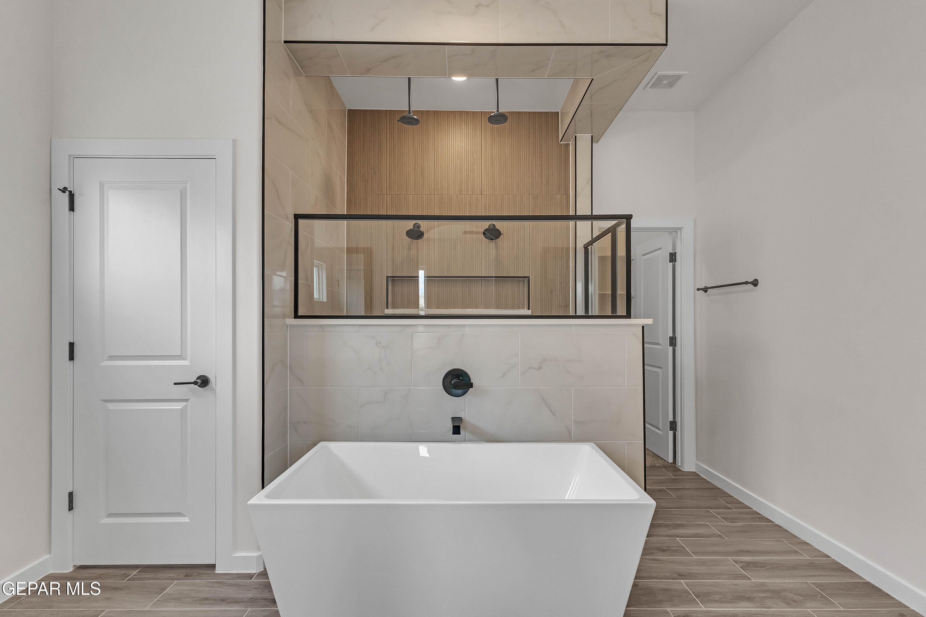 7264 Cimarron Rim Drive El Paso, TX 79911 - Photo 15 of 21 a bathroom with a white bath tub