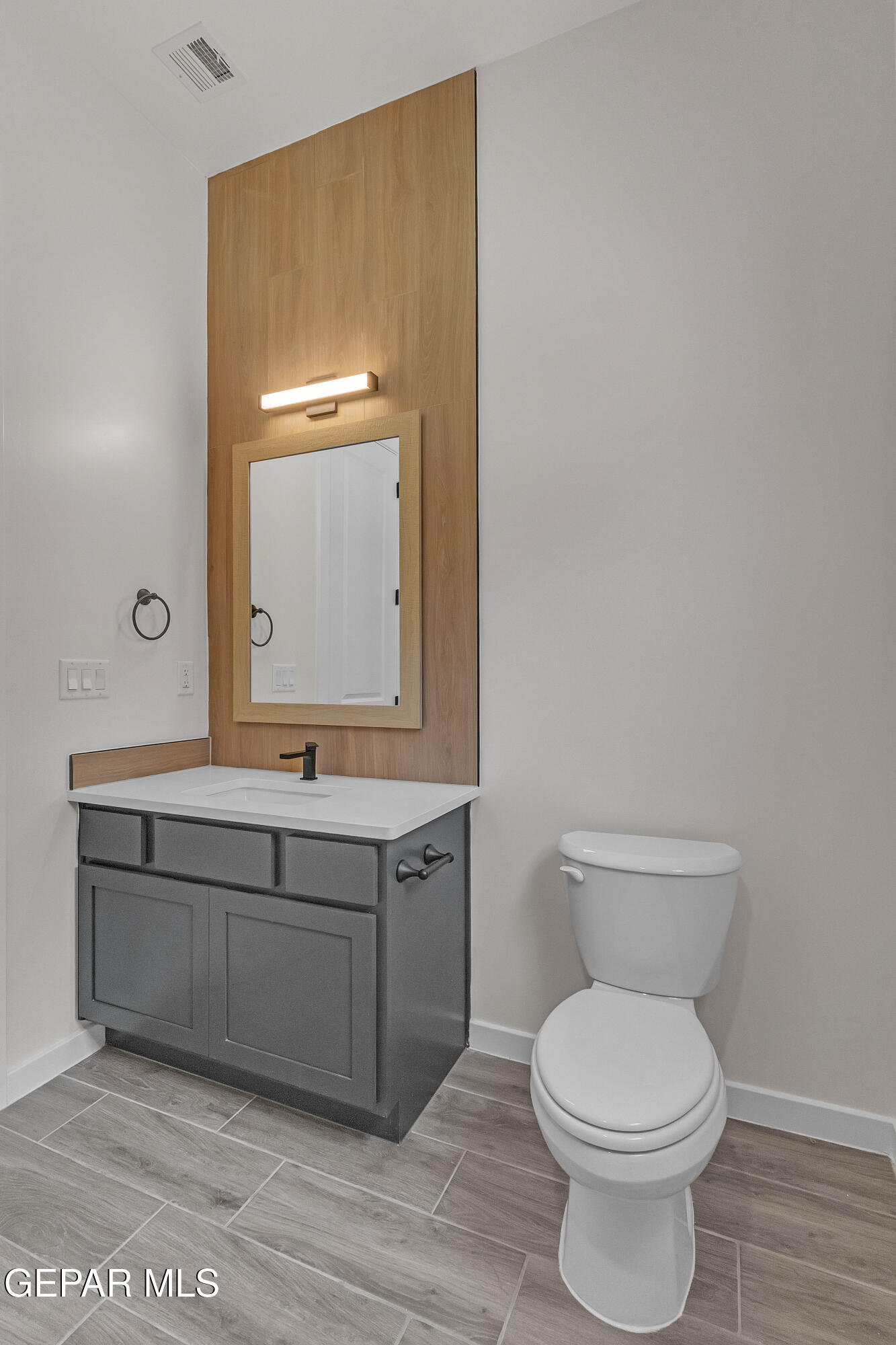 7264 Cimarron Rim Drive El Paso, TX 79911 - Photo 18 of 21 a bathroom with a toilet a sink and mirror