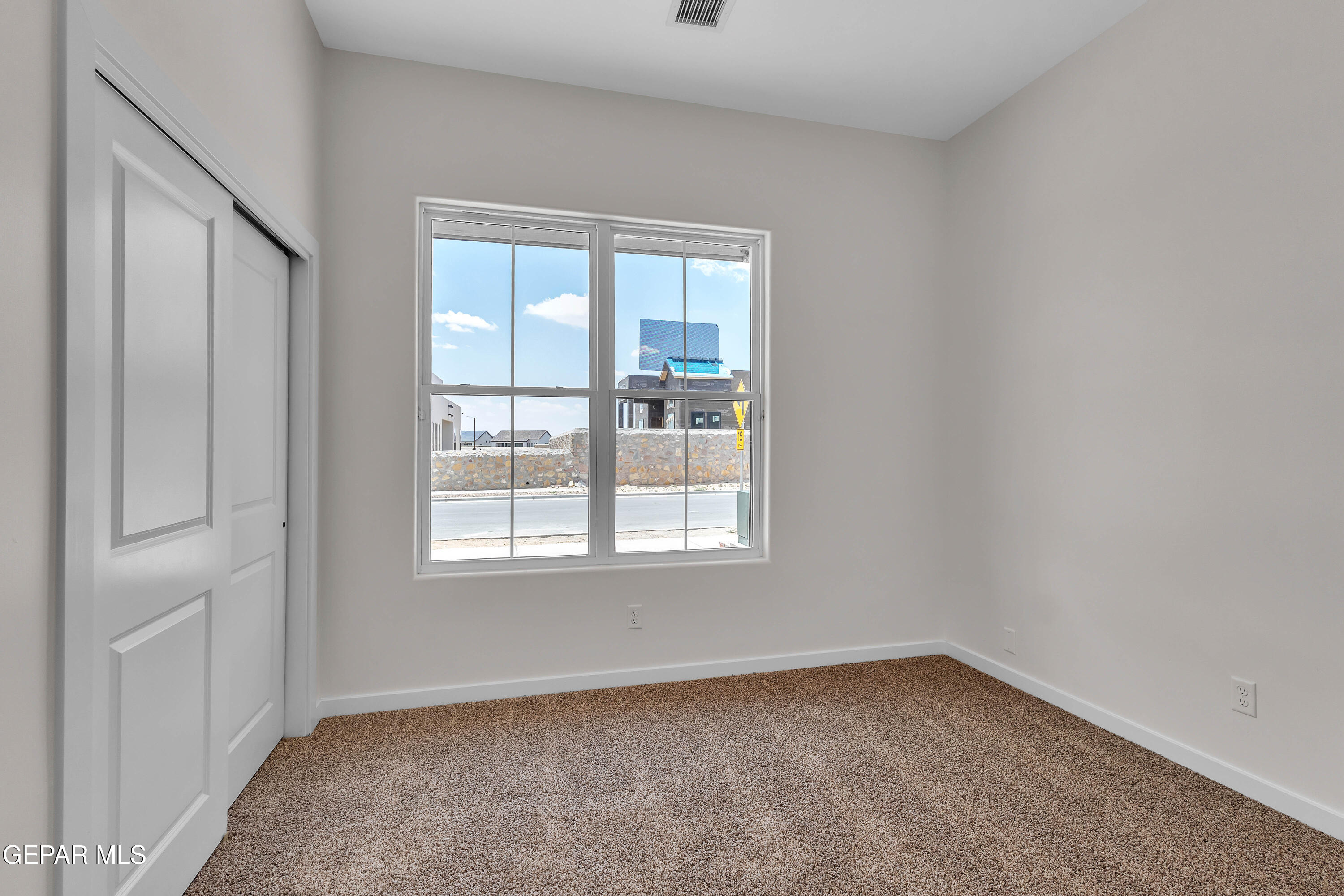 7264 Cimarron Rim Drive El Paso, TX 79911 - Photo 20 of 21 an empty room with a window